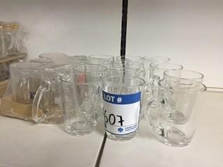 Lot of Assorted Small Clear Glass Mugs.