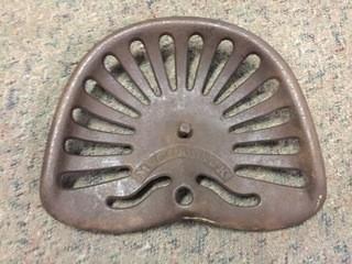 McCormick Cast Iron Tractor Seat.