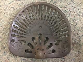 Walter A. Wood Cast Iron Tractor Seat.