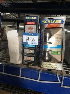 (2) Schlage Door Knobs & Toilet paper Holder.