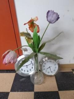 (2) Clocks C/w Vase And Flowers
