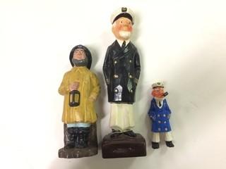 3- Boat Captain Figures 1- Porcelain - Black Jacket - 8.5"  2- Plastic - Yellow Jacket - 6.5" - 1974 - By Avalon Industries    3- Plaster - Blue Jacket - 4".