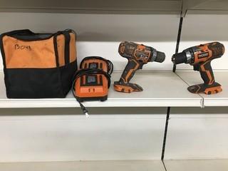 Lot of (2) Ridgid 18V Battery Powered Drills w/ Chargers And Case.