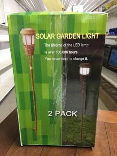 (2) Two Pack Solar Garden Lights.