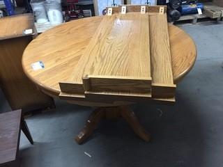 48" Solid Oak Round Dining Table w/ 3 10" Extension Leafs.