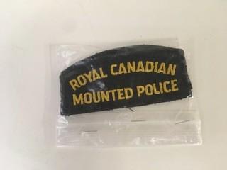 (2) Royal Canadian Mounted Police Badges.