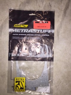 Quantity of Assorted Metal Car Stereo Adapter Plates.
