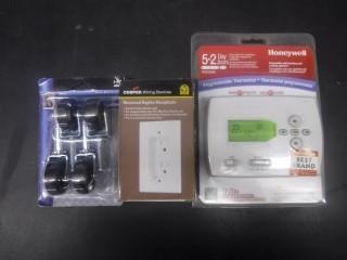 Honeywell Programmable Thermostat, Copper Wiring Devices, Shepherd Swivel Bearing Casters, Assortment of Miscellaneous Household Items.