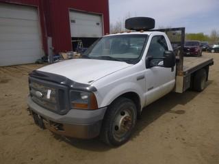 2005 Ford F-350 Flat Deck Truck C/w Power Stroke Turbo V8, Diesel, Manual Transmission, Headache Rack And Storage Cabinet. Showing 201,819kms. VIN 1FDWF36P85EB84267