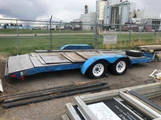 16' Flat Deck Utility Trailer c/w Spare Tire. No VIN or Registration 24' overall, 16' deck and 2' beaver tail.