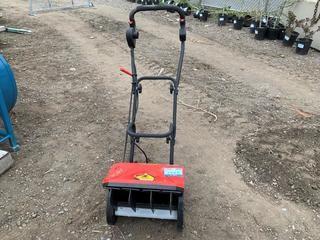 Electric Snow Thrower.