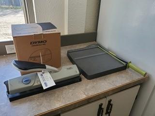 (1) Dymo Label Writer, (1) Paper Cutter And (1) Hole Punch