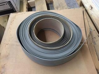 Box of Gray Rubber Base Moulding.