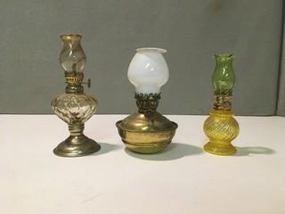 (3) Oil Lamps, (2) 5"H, (1) 4"H.