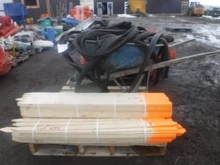 Lot of Assorted Wooden Posts, Wheelbarrow, Rubber Seals, Etc.