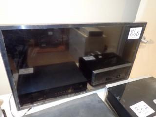 Samsung 32" Flatscreen Television. ** NOTE: REMOTE AT AUCTION OFFICE**