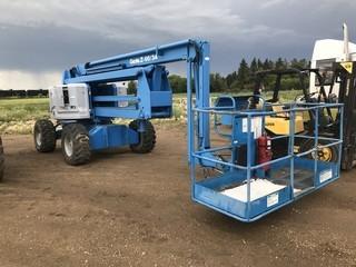 Genie Z-60/34 4x4 Gas Manlift. Ford 4-cylinder Gas Engine, Showing 5,673hrs. SN 1217.
