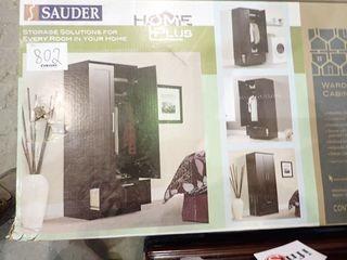 Sauder Wardrobe/Storage Cabinet- Dakota Oak Finish. **NEW AND UNUSED IN BOX**