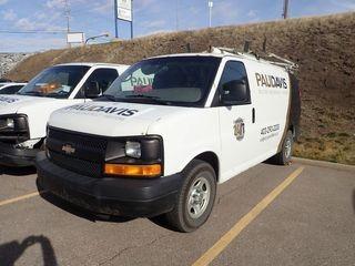 2007 Chevrolet Express 1500 Cargo Van. Gas Engine, Automatic Transmission, Ladder Rack, Cab Partition, Adrian Steel Cargo Organizer, Showing 293,338kms. VIN 1GCFG15X471142311. **WINDSHIELD HAS BEEN REPLACED**