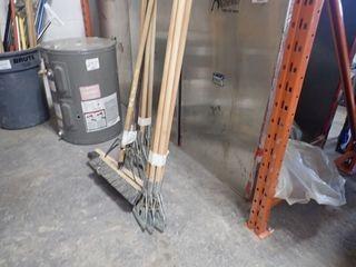 Lot of Asst. Mop Handles and Brooms. 