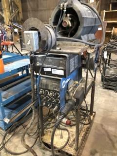 Lot of Miller 60 Series Dual Gun Wire Feeder, Miller Process Selector Control, Miller Coolmate 4 and Cart.