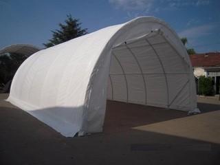 Unused 20'x30'x12' Peak Ceiling Storage Shelter c/w Commercial Fabric, Roll Up Door. Control # 7101.