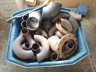 Assortment Of Pipe Bends And Flanges