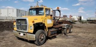 1990 Ford L9000 T/A Winch Tractor, c/w CAT 6 Cyl, 13 Speed Standard Transmission, Braden w/ Winch, Showing 347,215 KMS. VIN# 1FDYW90X8LVA25461. Unit 59 ** Damage To Hood**