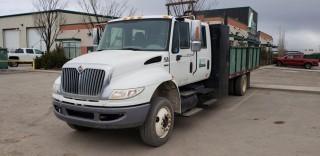 2011 International 4300 S/A Crew Cab Flatbed Truck, c/w Maxxforce Diesel Engine, Auto Transmission, w/ Deck, Cabinets, High Sides, 1 - 8' Section, 1 - 8' Rear Tilt Section, Side Reel w/ Hose, Showing 120,095 KMS. VIN# 1HTMMAAP9BH309982. Unit 150