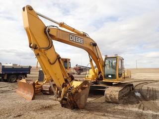 2001 John Deere 230LC Excavator. John Deere 6068H Diesel Engine, 32" Triple Grouser Pads, 42" Digging Bucket w/Hydraulic Thumb, Showing 10,324hrs. SN FF0230X600930. **LOCATED IN MILK RIVER**