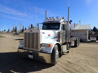 2007 Peterbilt 379 Tandem Axle Texas Bed Truck. Cat C15 500hp Diesel Engine, 18-Speed Transmission, 12,000lbs Front Axle, 40,000lbs Rear Axles, 11R24.5 Tires, Aluminum Budd Wheels, 184" W/B, Sliding Fifth-Wheel,  30-Ton Winch, Live Roll. Showing 702,534kms, CVIP Expires 08/19. VIN 1XP5DB9X87D658334. **LOCATED IN MILK RIVER**