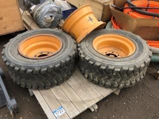 Lot of (2) 12-16.5 Skid Steer Tires c/w (3) Rims to Fit Case.