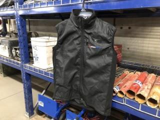 CHARITY ITEM:  NEW - Asphalt Surfer Heated Vest Size XXXL. Retail value $224.95. Proceeds of sale of this Lot to be donated to Alberta 4-H.  For winning bids in excess of Retail Value, Winning bidder will be named on Century’s Wall of Fame as contributing to community and youth programs across Western Canada.   