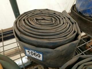 Roll of 4" Water Discharge Hose.