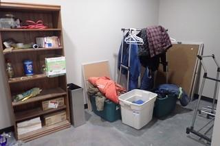 Lot of Coveralls, White Boards, Clothing Racks, Bookcase, etc. 
